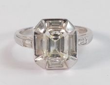 Platinum Art Deco style diamond ring, with square set ring head with central emerald cut diamond 6.