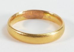 Gold wedding ring / band tested as around 22ct, but hallmark indistinct and may be of overseas