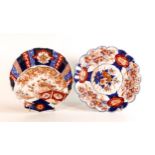 Meiji Period (1868-1912), two Imari plates. One decorated with a potted floral arrangement, floral