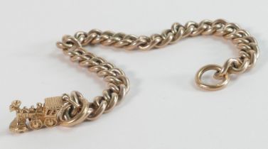 Heavy 9ct gold curb link bracelet with small gold train charm, clasp missing, 17.75cm wearable