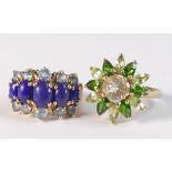 Two 9ct gold QVC ladies dress rings, one set with green stones, size M and the other set with blue