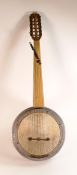 12 string fretless Banjo with 6 pairs of strings and deep aluminium body, labelled "Mucidi Zeynel