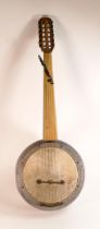 12 string fretless Banjo with 6 pairs of strings and deep aluminium body, labelled "Mucidi Zeynel