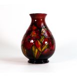 Walter Moorcroft Flambe vase decorated in the Orchid design, Queen Mary paper label to base, h.18.