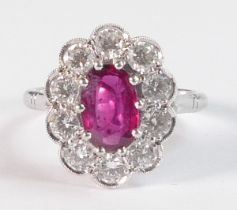 18ct white gold ruby and diamond cluster ring, set with central oval cut ruby (9mm x 5.8mm x 2.