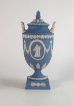 Wedgwood blue Jasperware two handled urn & cover, decorated with floral swags and oval panels of