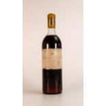 A bottle of 1959 red wine "Château D'Yquem, Lur Saluces". Label has tears & soiled, wine 3.5cm below