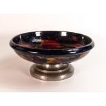 William Moorcroft large footed fruit bowl decorated in the Pomegranate design, Tudric Pewter base,