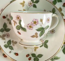 A large collection of Wedgwood Wild Strawberry pattern dinner & tea ware including tureens, trios,
