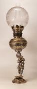 American chromed metal oil lamp as Putti with flute, similar bowl, chimney & shade, height