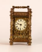 Exceedingly ornate brass carriage clock, late 19th century, no key, sold as not working. 15cm high