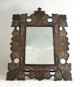 Late 19th century North African silver toilet mirror, unmarked. Ornamentation consisting of stylised