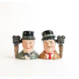 Royal Doulton pair of small jugs Stan Laurel D7008 and Oliver Hardy D7009, limited edition. (2)