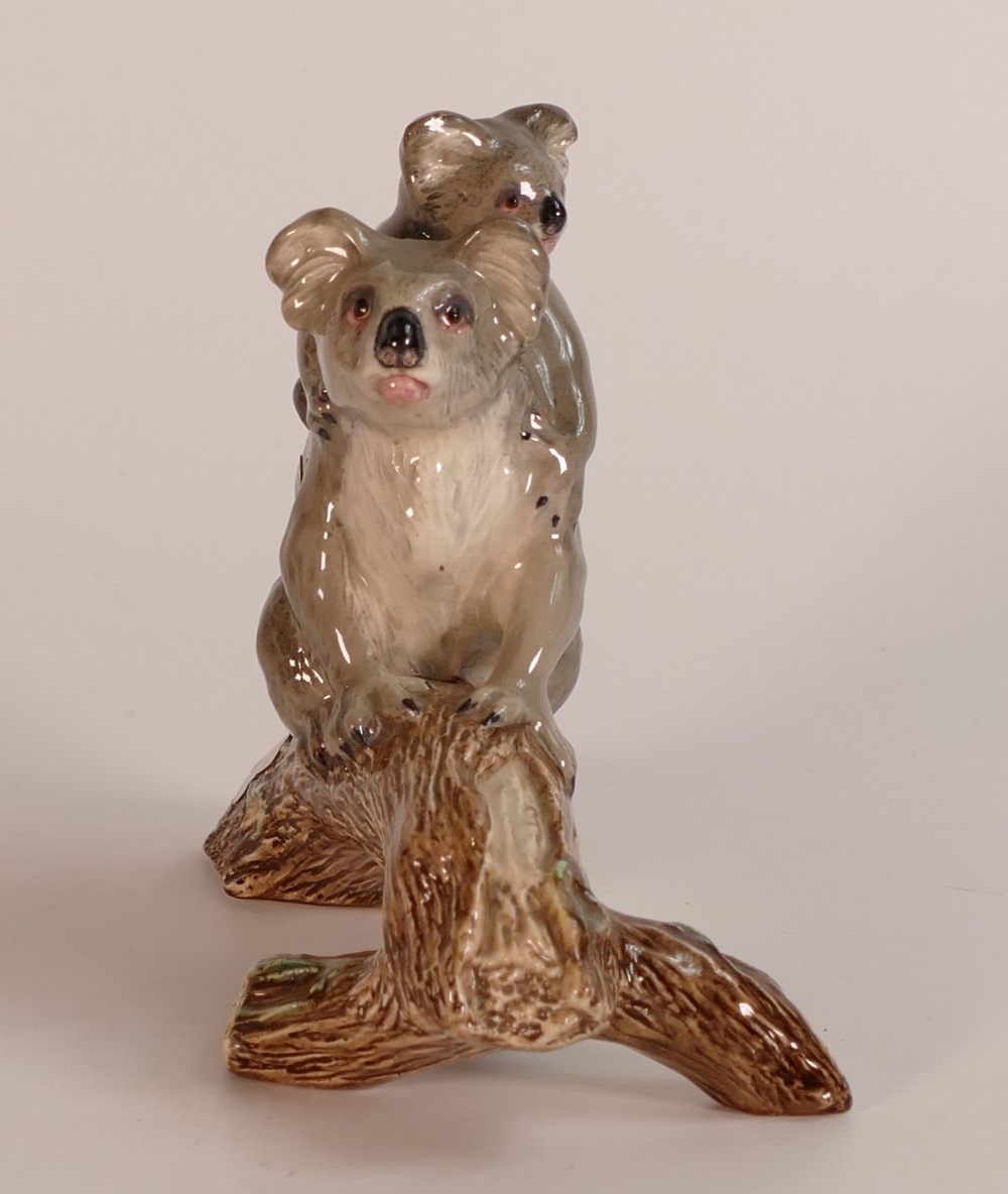 Beswick Prototype Figure of a Koala bear with baby on its back, climbing a tree branch, possibly