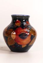 William Moorcroft small vase decorated in the Pomegranate design, c1920s, h.8.5cm.