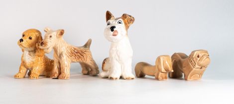 A collection of Sylvac pottery animals to include Terrier, stylized Dachshund & Bulldog, comical
