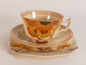 Clarice Cliff, tea trio in the 'Rhodanthe' pattern, hand painted in brown and orange shades