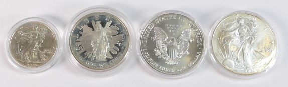 A collection of Silver USA encapsulated coins, to include 2000 & 2002 Silver 1oz fine dollars,