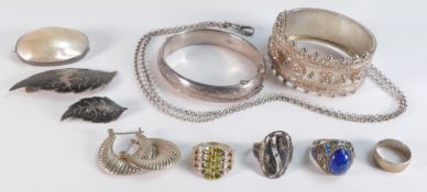A collection of silver jewellery including rings, bracelets, brooches, earrings etc., 126.4g.
