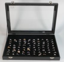 A good large collection of mainly costume jewellery rings, each set with various coloured stones, in