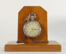 Silver plated military top winding pocket watch, marked G.S.T.P 266252 with albert chain on wood