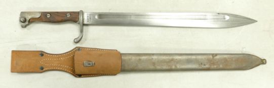 World War I style bayonet, smooth grip with leather frog, metal scabbard. Stamped Jahengkls