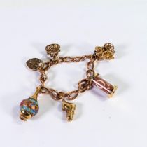 9ct rose gold bracelet, with 5 x 9ct gold charms, gross weight 40.4g.