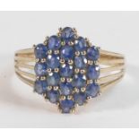 Ladies 9ct gold ring set with blue stones, size X,3.8g.