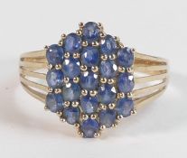 Ladies 9ct gold ring set with blue stones, size X,3.8g.