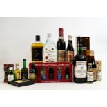 A mixed collection of spirits to include - vintage Johnnie Walker, Talisker miniatures, half