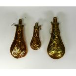 Three 19th century embossed copper and brass powder flasks, two by G.& J.W. Hawksley & signed to the