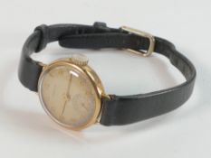 9ct gold ladies Cyma wristwatch with leather strap.
