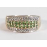 Ladies 9ct gold ring set with green stones, size N,5.1g.