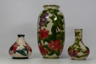 Three Cobridge stoneware floral vases. Height of tallest 22cm