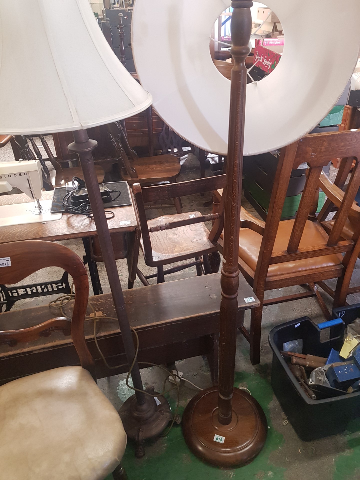 A Pair of Standards Lamps, one in Oak with Fluted Body, the other of Metal with fluted body and claw