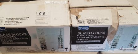 Two boxes of 10 Wickes glass blocks.