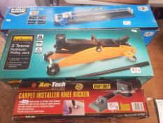 A collection of tools to include Halfords 2 Tonne trolley jack together with a carpet installer