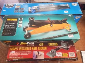 A collection of tools to include Halfords 2 Tonne trolley jack together with a carpet installer