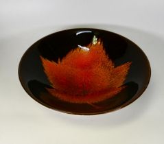 Poole pottery bowl with a leaf design.Diameter 26.5cm