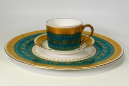 Minton Dinner plate and Coffee Duo on Green Ground and profusely gilded.