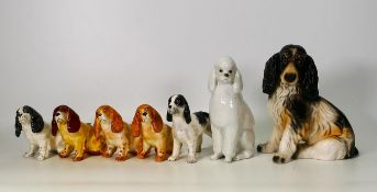 A collection of pottery dogs including Midwinter Spaniels, Goebel items & Russian Made poodle,