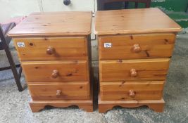 A pair of modern pine bedside cabinets