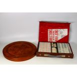 Cased Mah-Jong set & Malaysian wooden peg board, diameter of board 28.5cm(2)