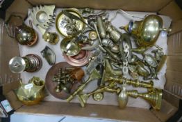 A large heavy collection of brass ware to include candlesticks, ornamental teapots, ornaments,
