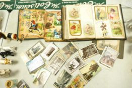 A collection of Early 20th Century black & white / colour postcards and similar age scrap books