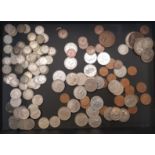 A collection of UK pre-decimal and decimal coins to include 3 pence pieces, six pence pieces,