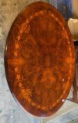 Mahogany Rosewood Inlaid Tilt top Oval Dining Table raised on quadrofoil pedestal base