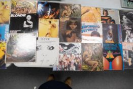 A collection of 1980's & later Lp Records & 12" singles including Pop, Reggae, Rock themes