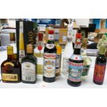A collection of vintage liqueurs including Galliano, Alfred Schladerer, Cachaca, Lapponia, Triple