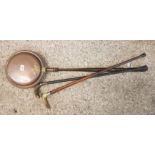 Copper Bedwarming pan together with two walking sticks, one with antler handle